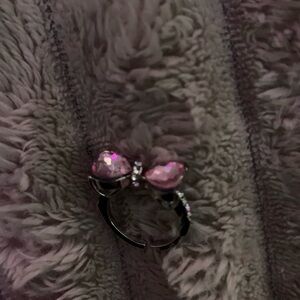 Solver ring with pink bow on top